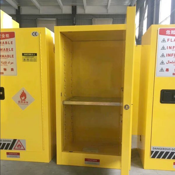 Flammable storage cabinet with the door open, showing adjustable shelves and the base sump
